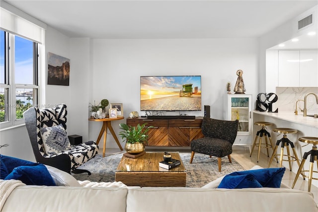 living room featuring sink