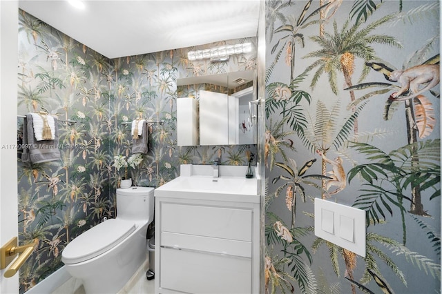 bathroom with vanity and toilet