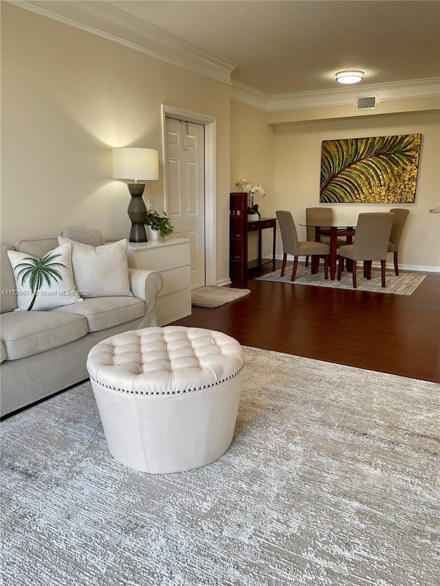 living room with crown molding and dark hardwood / wood-style flooring