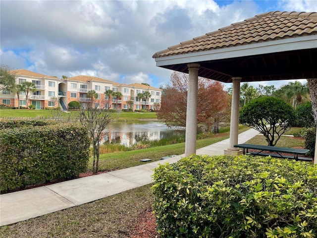 surrounding community featuring a gazebo and a water view