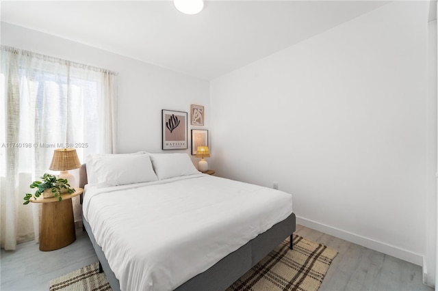 bedroom with light hardwood / wood-style floors