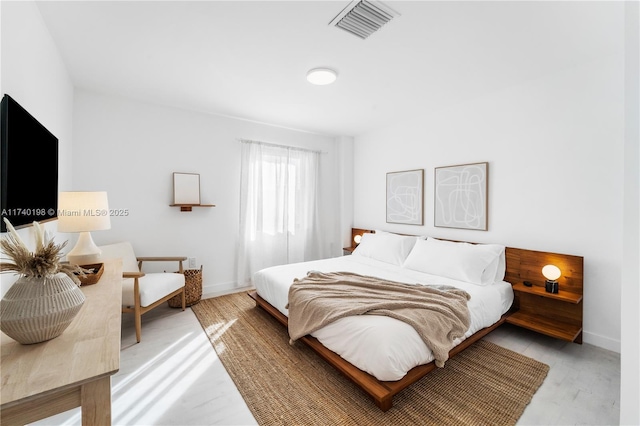 bedroom with light hardwood / wood-style floors