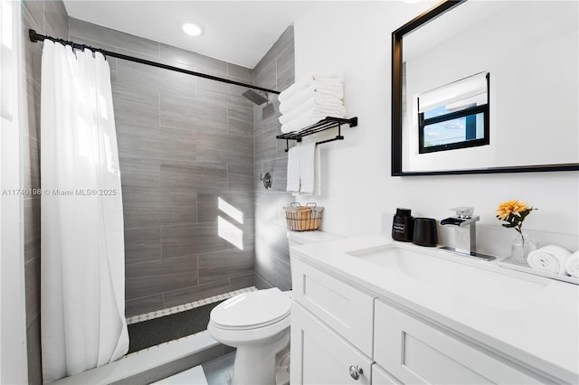 bathroom featuring vanity, a shower with curtain, and toilet