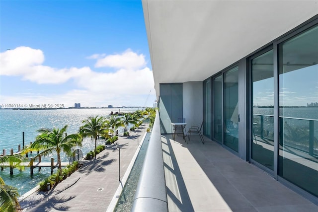 balcony featuring a water view