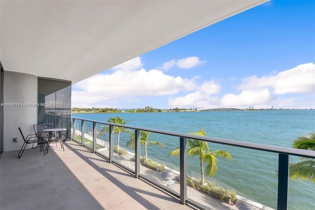 balcony featuring a water view