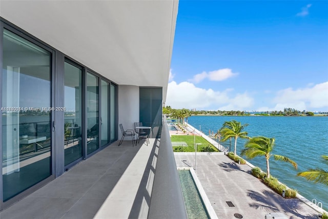 balcony featuring a water view