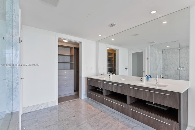 bathroom with vanity and an enclosed shower