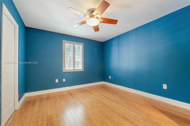 unfurnished room with ceiling fan and light wood-type flooring