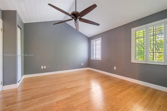 unfurnished room featuring lofted ceiling, ceiling fan, and light wood-type flooring