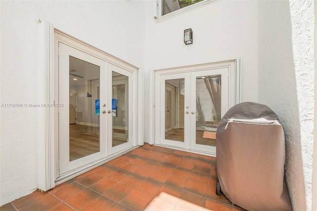 property entrance featuring french doors