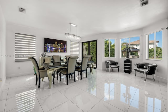 dining area with marble finish floor, visible vents, and baseboards