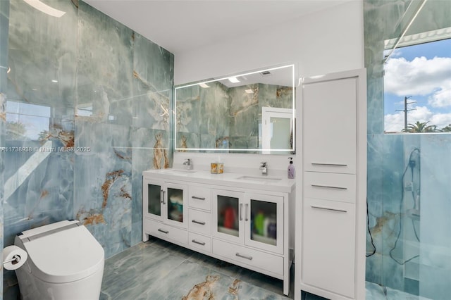 bathroom featuring double vanity, a sink, and tile walls