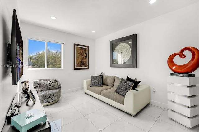 living area with baseboards and recessed lighting