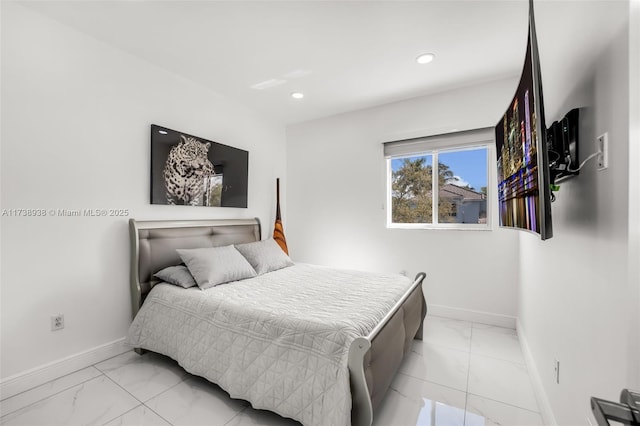 bedroom featuring recessed lighting, marble finish floor, and baseboards