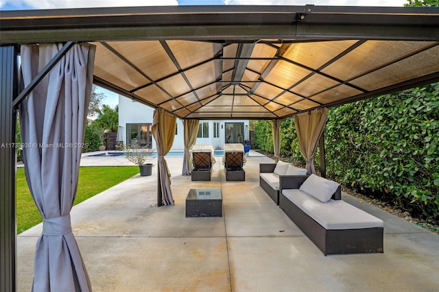 view of patio / terrace with an outdoor pool, outdoor lounge area, and a gazebo