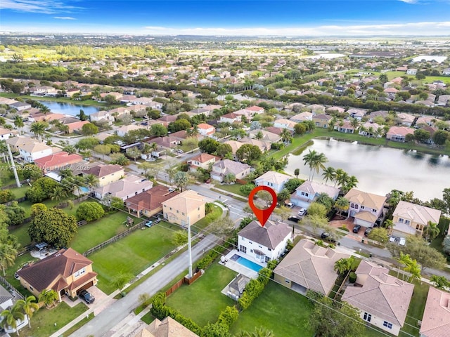 aerial view with a water view and a residential view