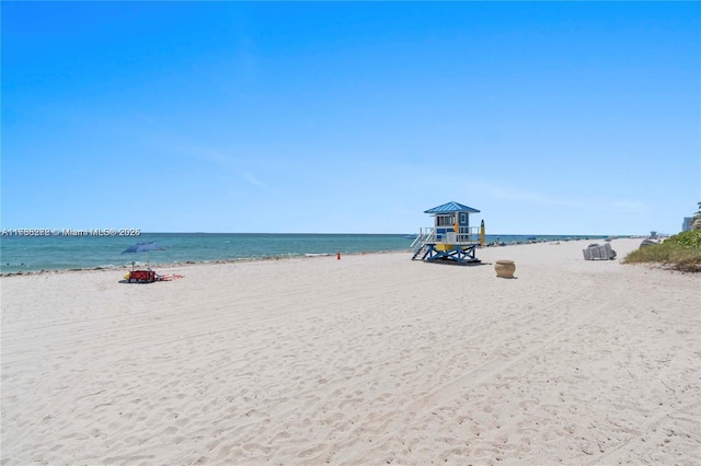 property view of water featuring a beach view