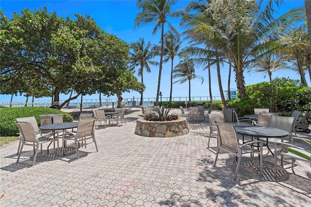 view of patio with outdoor dining area and fence