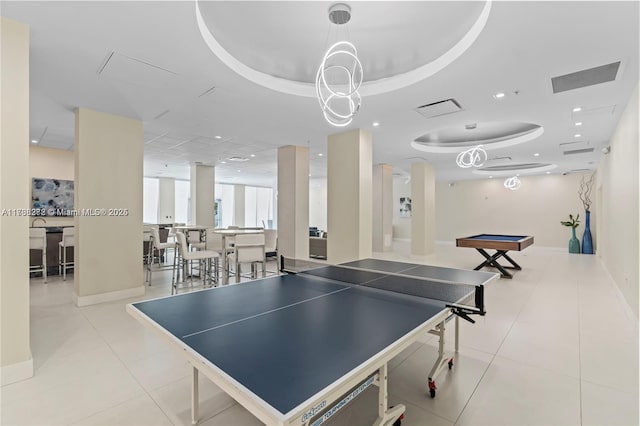 game room with a tray ceiling, tile patterned flooring, baseboards, and recessed lighting