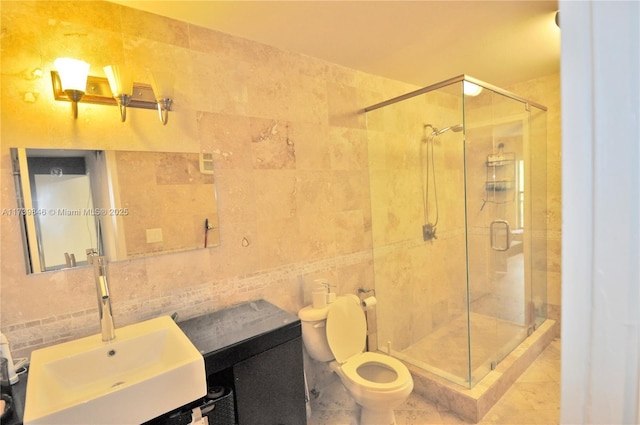 bathroom with toilet, an enclosed shower, tile walls, vanity, and backsplash