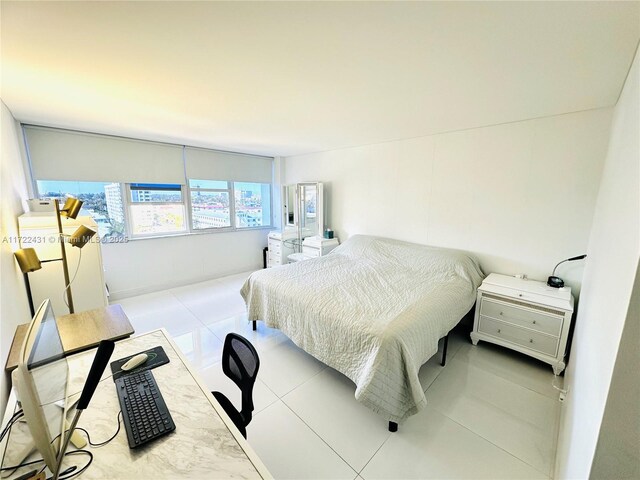 bedroom with light tile patterned flooring