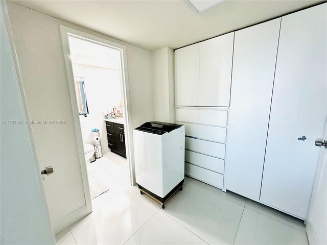 washroom with light tile patterned floors