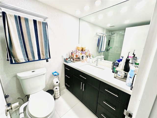 bathroom with tile patterned flooring, toilet, vanity, and a shower with shower door