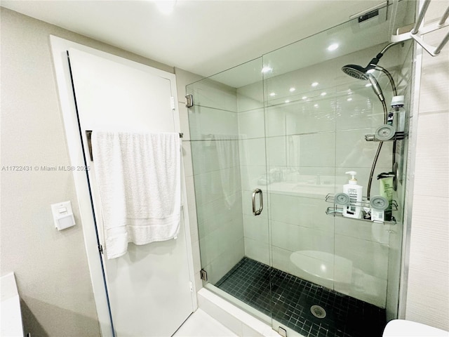 full bath featuring visible vents, a shower stall, and toilet