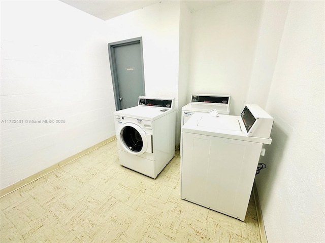 washroom with washer and dryer