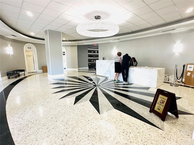 welcome area with arched walkways and visible vents