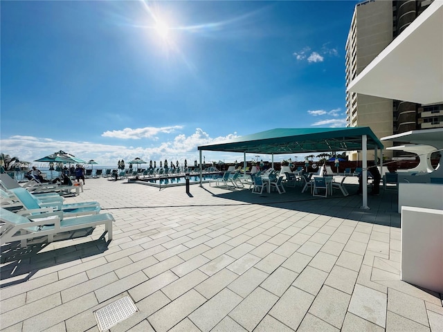 view of patio featuring a community pool