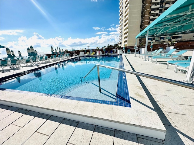 community pool with a patio area