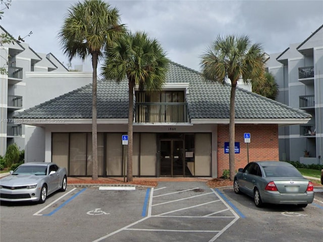 view of property featuring uncovered parking