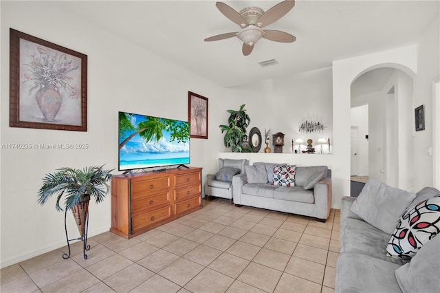 living room with light tile patterned floors and ceiling fan