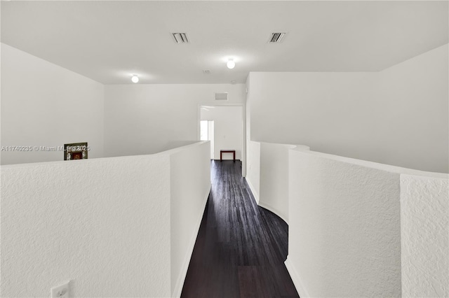 corridor featuring dark hardwood / wood-style flooring