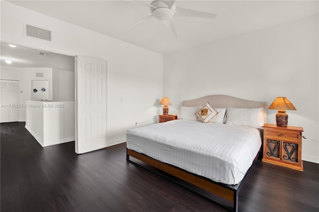 bedroom with dark wood-type flooring and ceiling fan