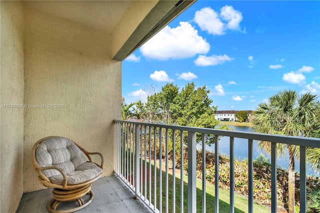 balcony featuring a water view