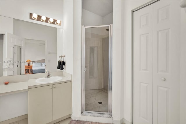 bathroom with vanity and a shower with door