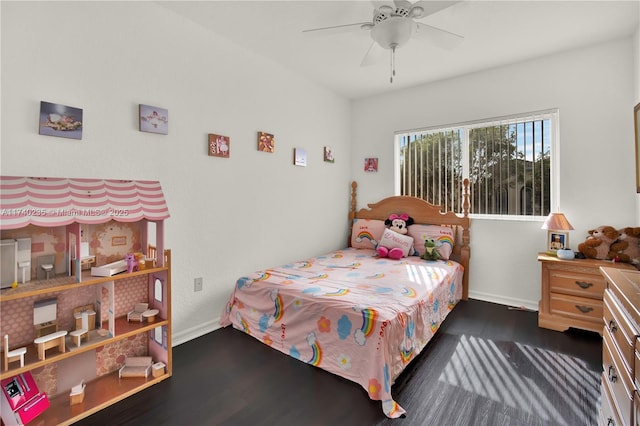 bedroom with ceiling fan and dark hardwood / wood-style flooring