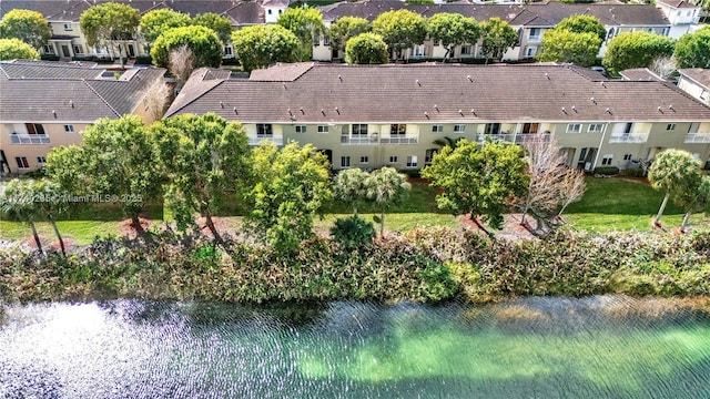 birds eye view of property with a water view