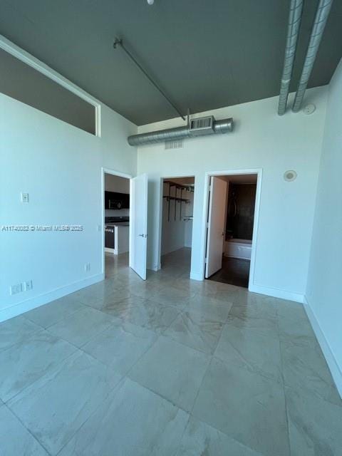 empty room featuring a high ceiling