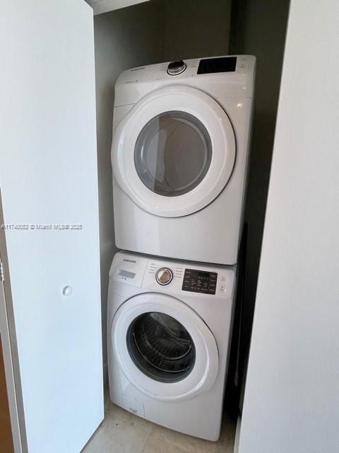 laundry area featuring stacked washer / dryer