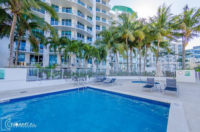 view of swimming pool featuring a patio area