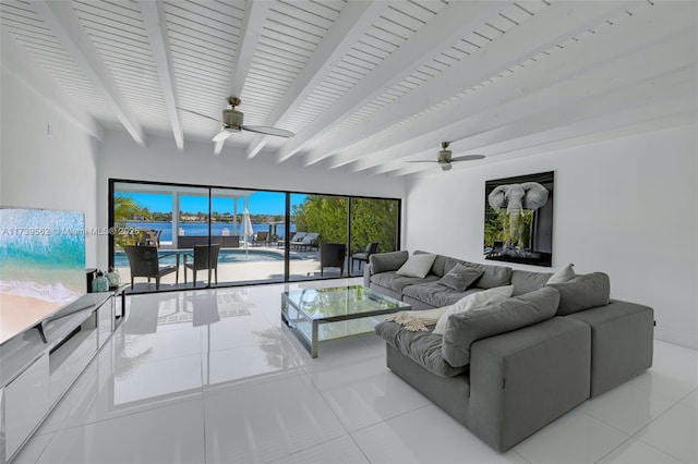 tiled living room with beamed ceiling and ceiling fan