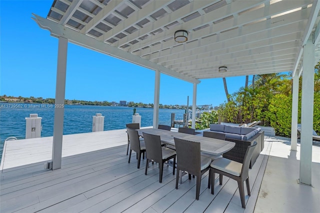 view of dock featuring an outdoor living space and a water view