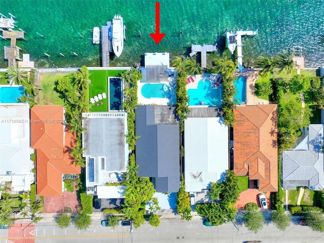 birds eye view of property with a water view