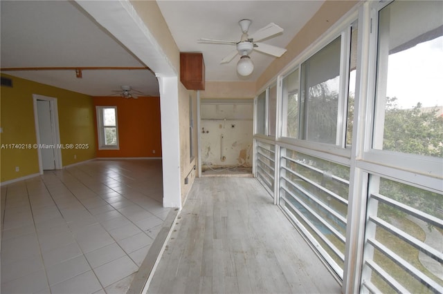 corridor featuring light hardwood / wood-style flooring