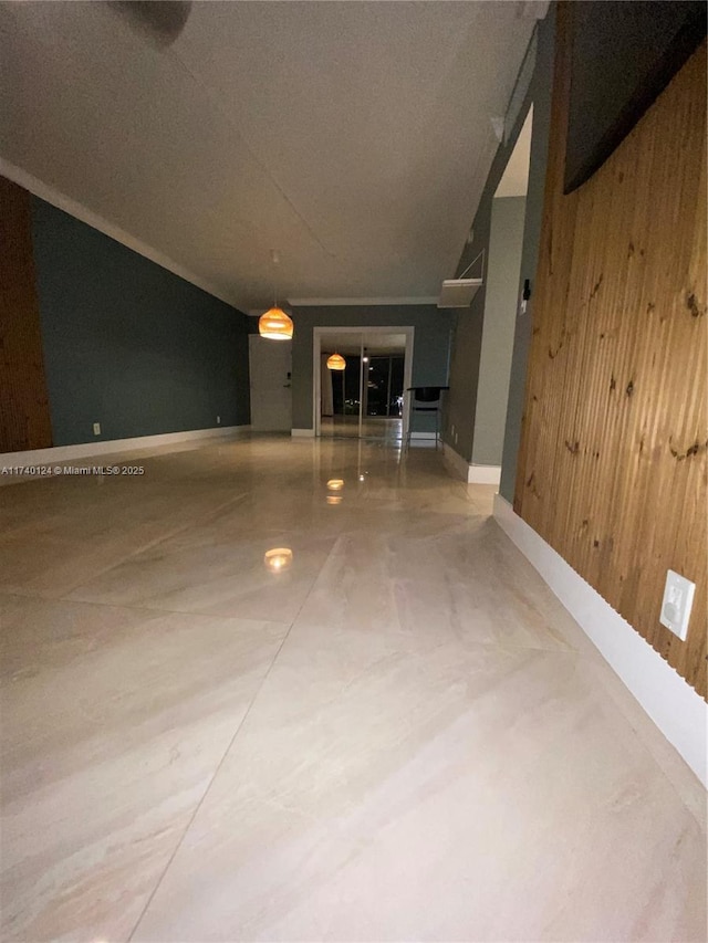 hallway featuring wood walls