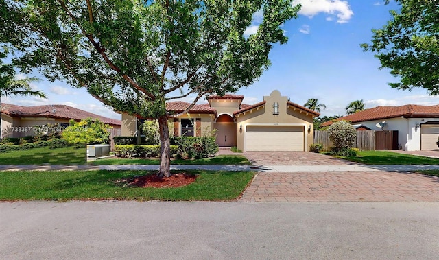 mediterranean / spanish-style home featuring a garage