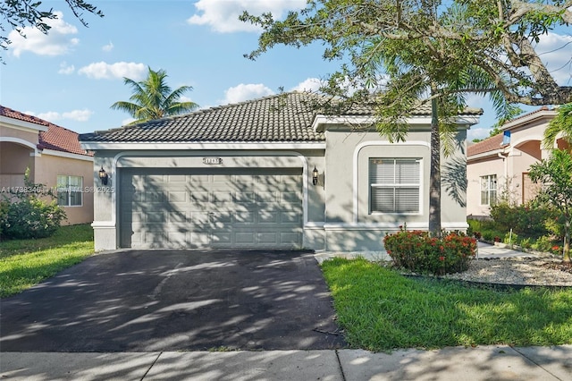 mediterranean / spanish-style house featuring a garage